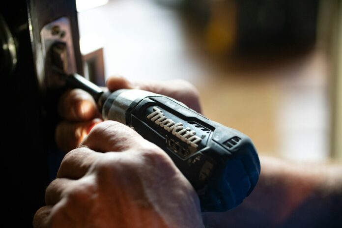 Photo by Theme Photos selective focus photography blue and black Makita power drill