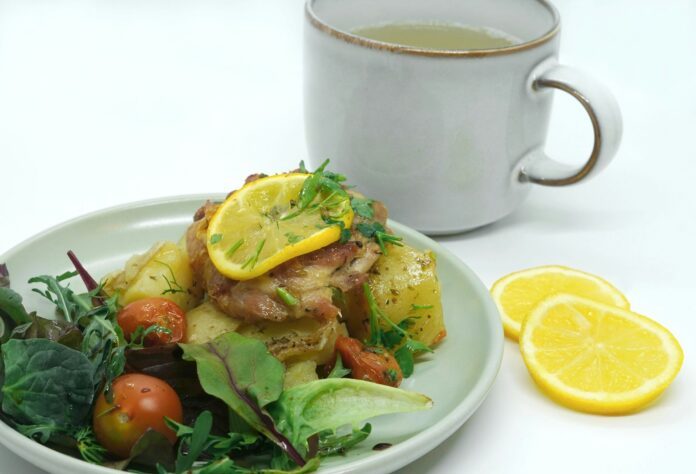 Photo by Babs Gorniak a plate of food next to a cup of tea