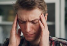 “지치고 무기력한 당신, 만성피로 벗어나기 위한 생활 속 작은 변화” a man holding his hands to his ears